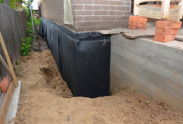 SJ Waterproofing Pros technician performing targeted Vapor Barrier Installation assessment in East Rochester, NY